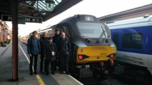 RailSoc members pose for a photo with a class 68 locomotive at Birmingham Moor Street before heading to London Marylebone