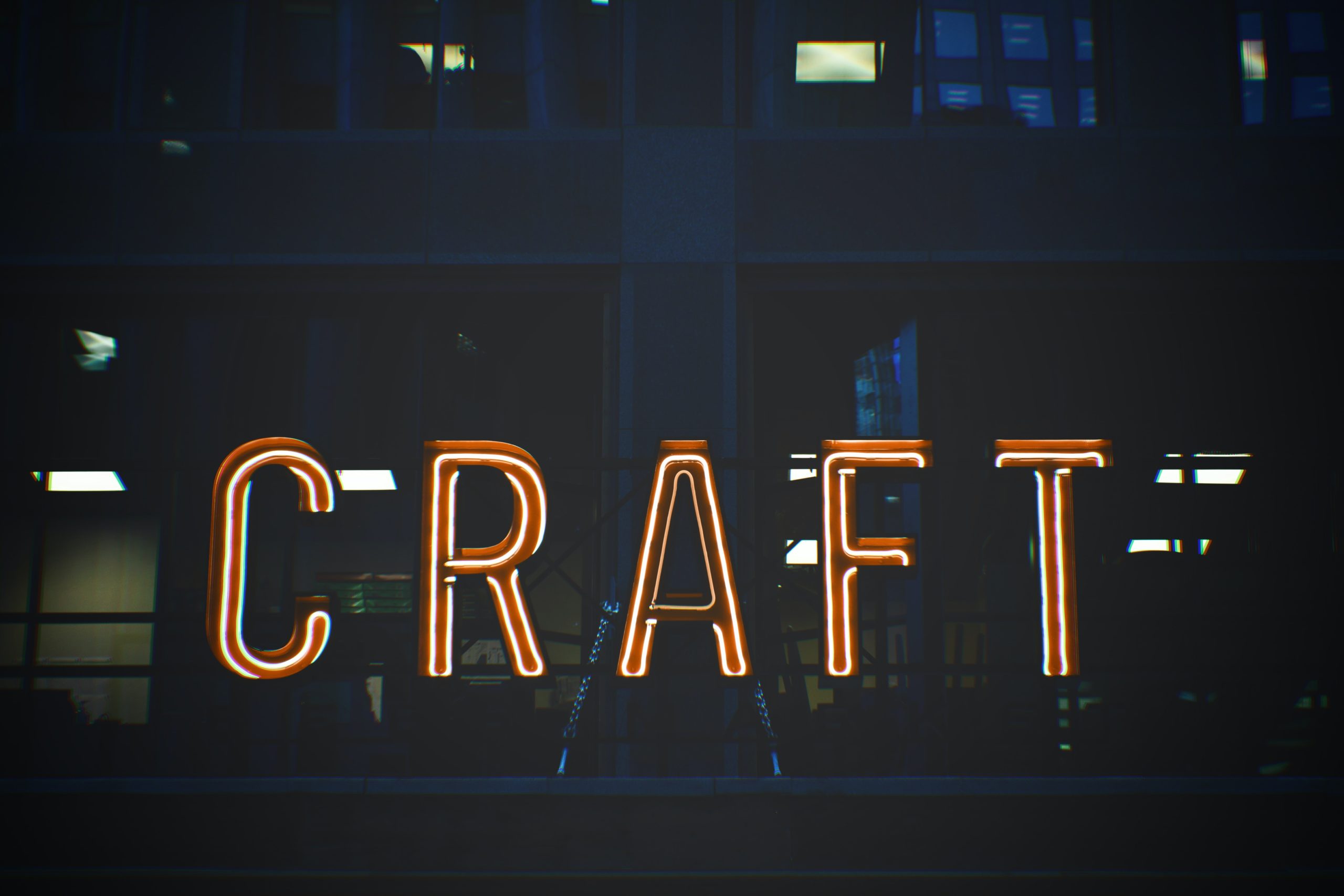 The word 'craft' in neon sign lighting