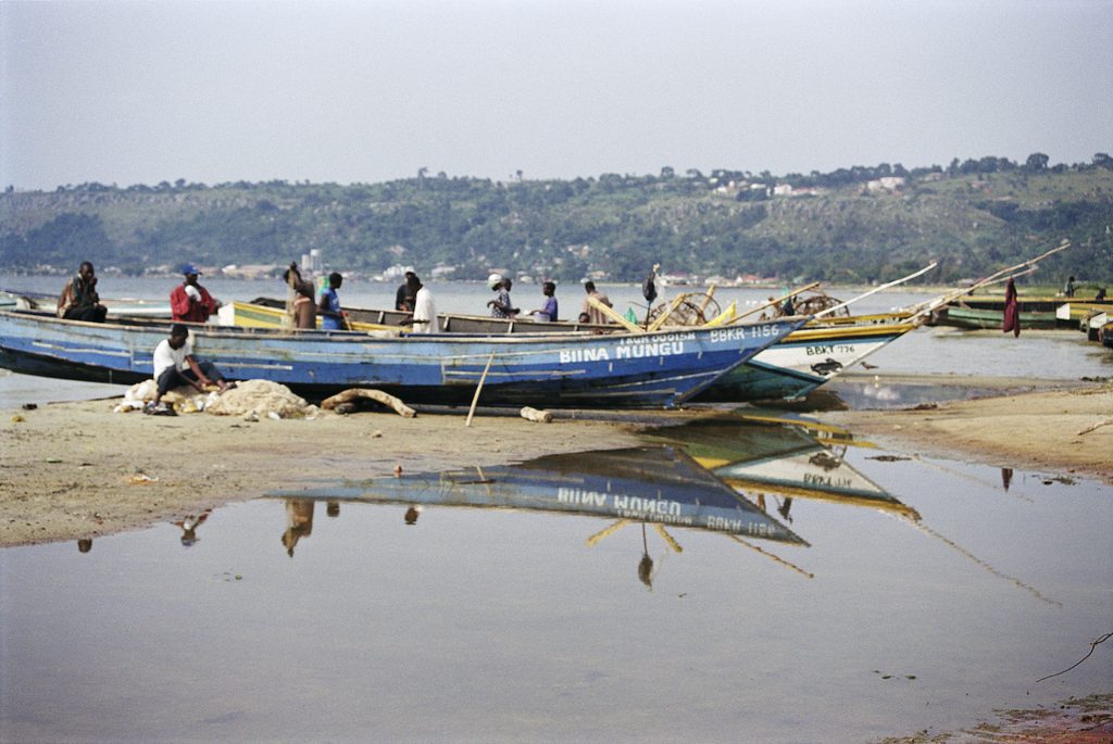 Fishermen prepare nets on shore of Lake Victoria.