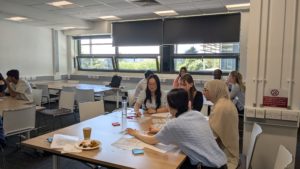 Group of young people in a classroom debating