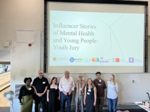 People standing with a presentation