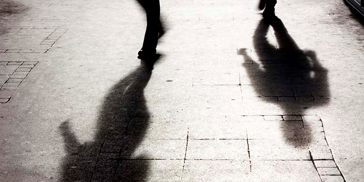 The shadows of two figures walking