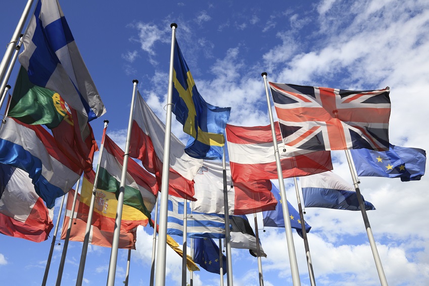 The flags which make up the European Union against a blue sky