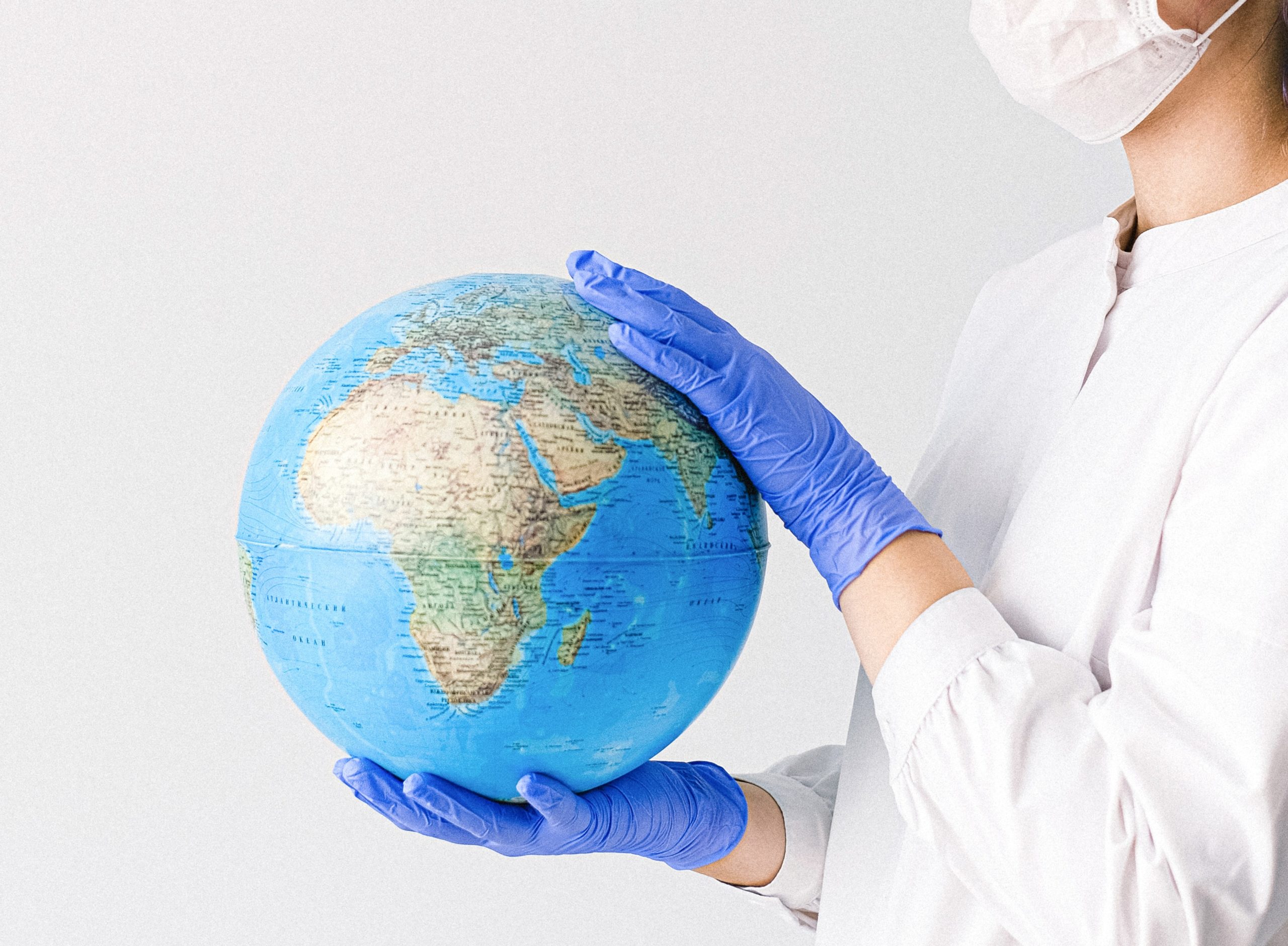 Doctor holding a globe