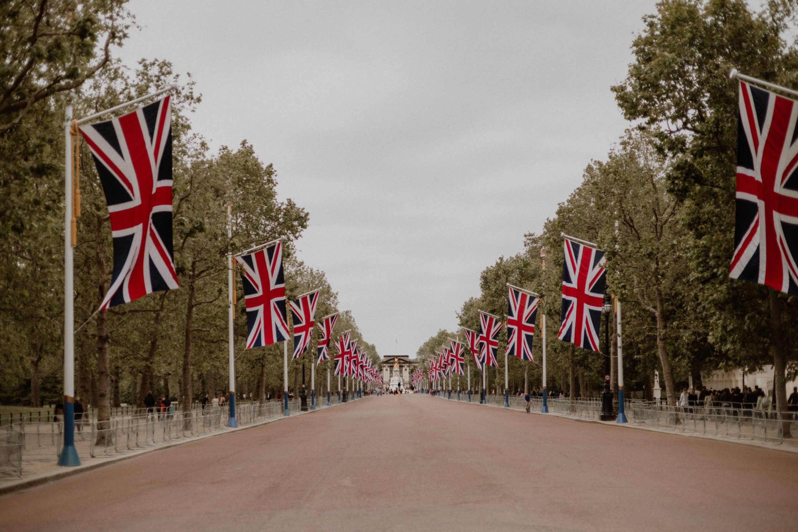 The road to Buckingham Palace lined with British flags and trees