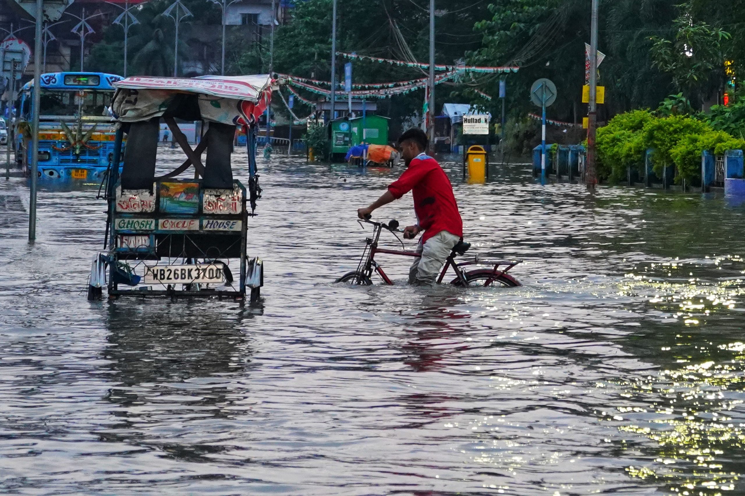 Person on a bike in a flooded street