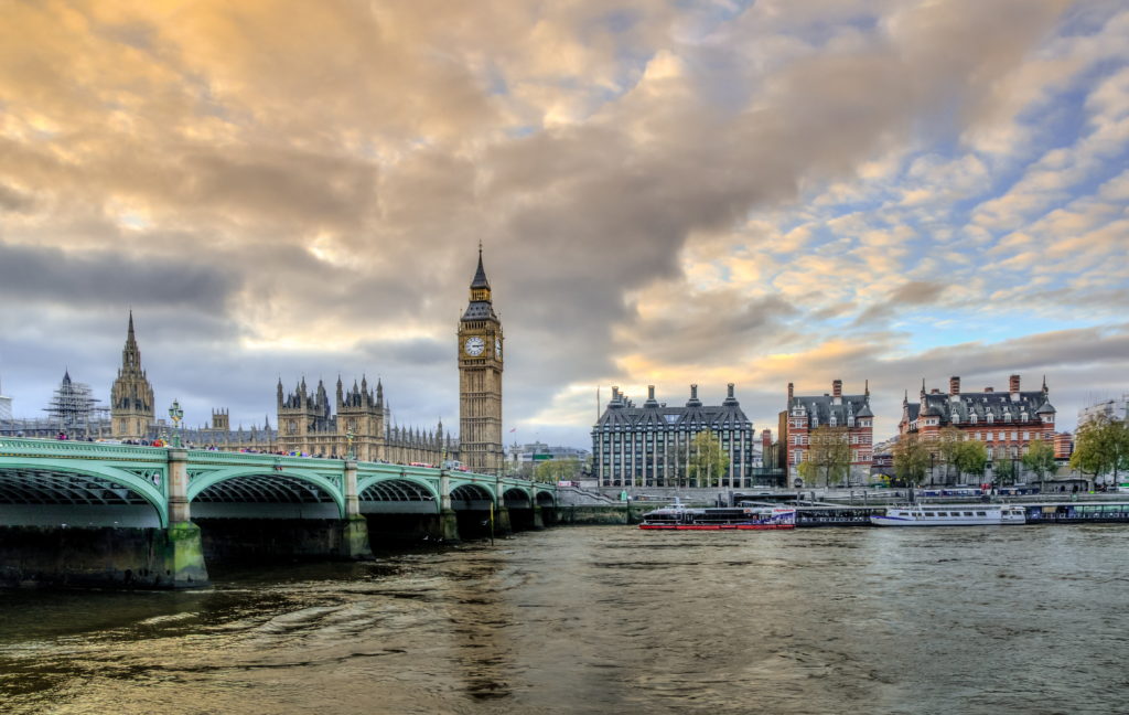 A landscape photograph of the River Thames with Big Ben and Victoria Bridge in the background. 