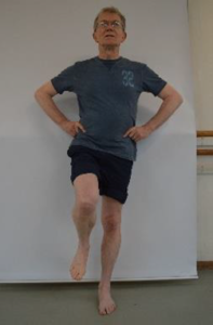 Man demonstrating Single leg balance with knee lift