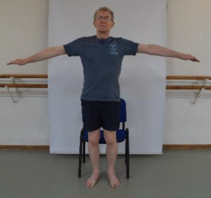 Man demonstrating sit to stand exerrcise step 2