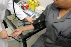 Image of a lady having her blood pressure taken