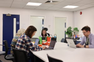 Research Software Engineers working on laptops