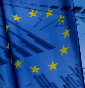 EU Flag over statistical papers