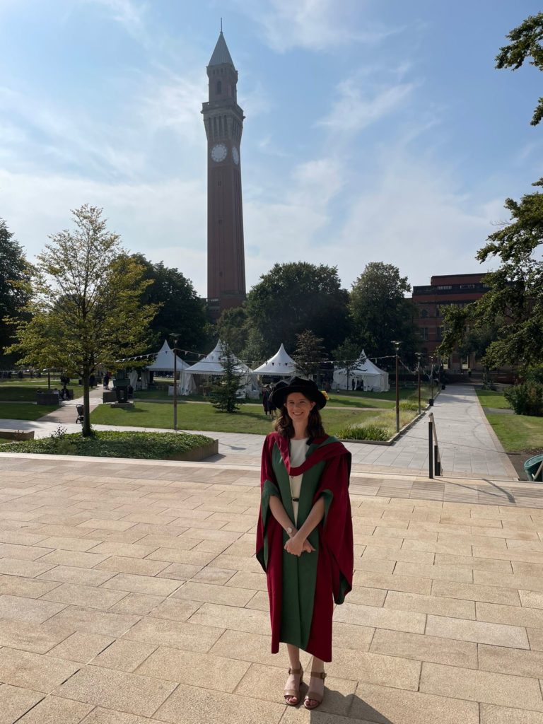 Katie Breheny, pictured standing in front of the clock tower at University of Birmingham.