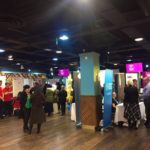 A view of the hall at the fair - lots of people, busy atmosphere